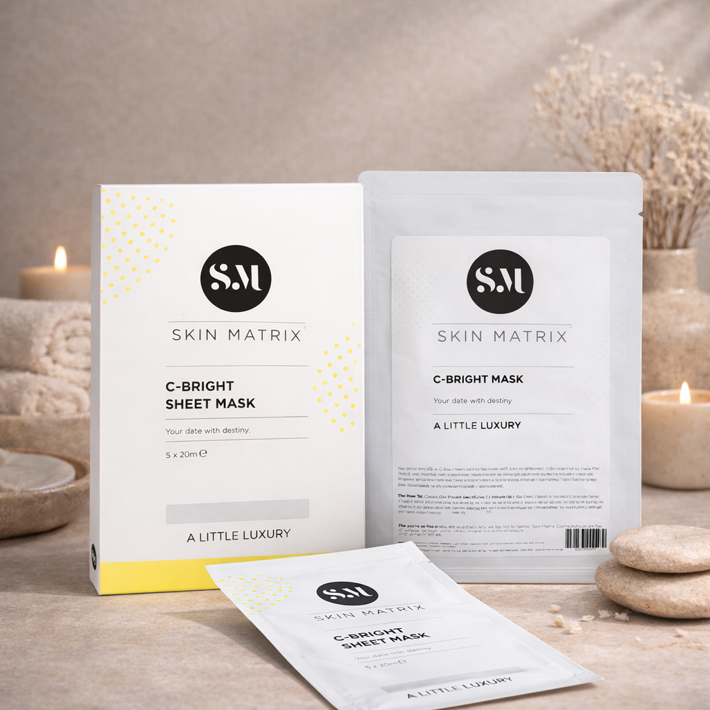 Skin Matrix C-Bright sheet masks on a decorative tray with candles and decorative items.